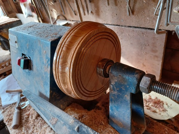 Small round hardwood pattress in Walnut width 125mm